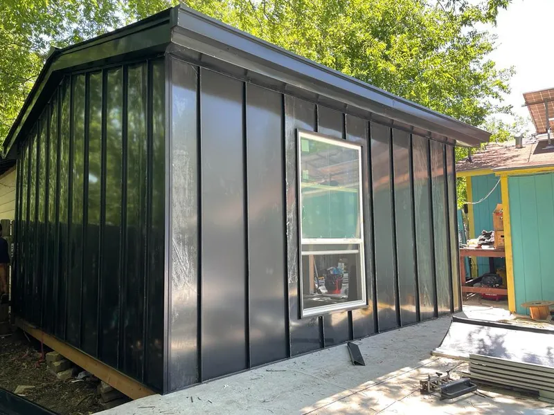 Black standing seam metal wall panels for Metal Roof Installation in Peterborough