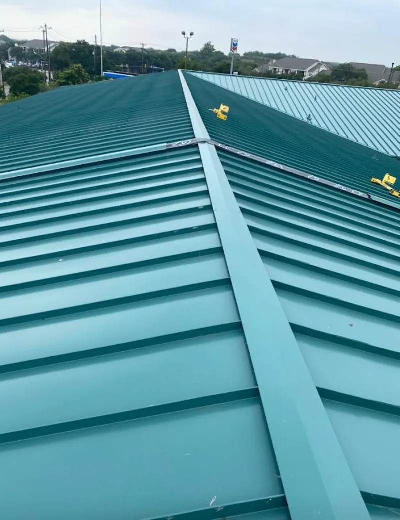 Green commercial metal roof ridge and valley for Metal Roof Repair in Peterborough